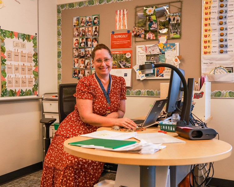 Stephanie Pederson, a third-grade teacher sits at her desk at the new Sunset Ridge Elementary School campus in Ridgefield on Thursday, Oct. 15.