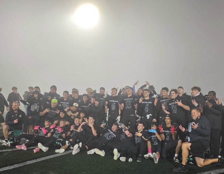 The fog rolled in just in time to celebrate Woodland’s league title Friday night.