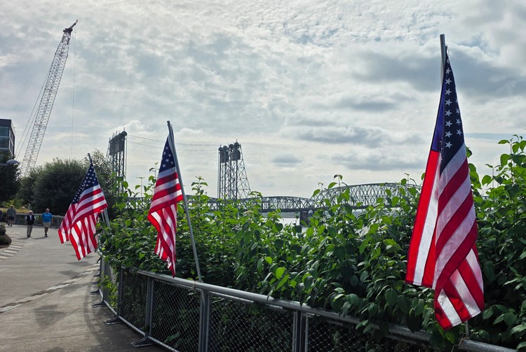 Flags were posted along the Waterfront, with the Interstate Bridge in the background