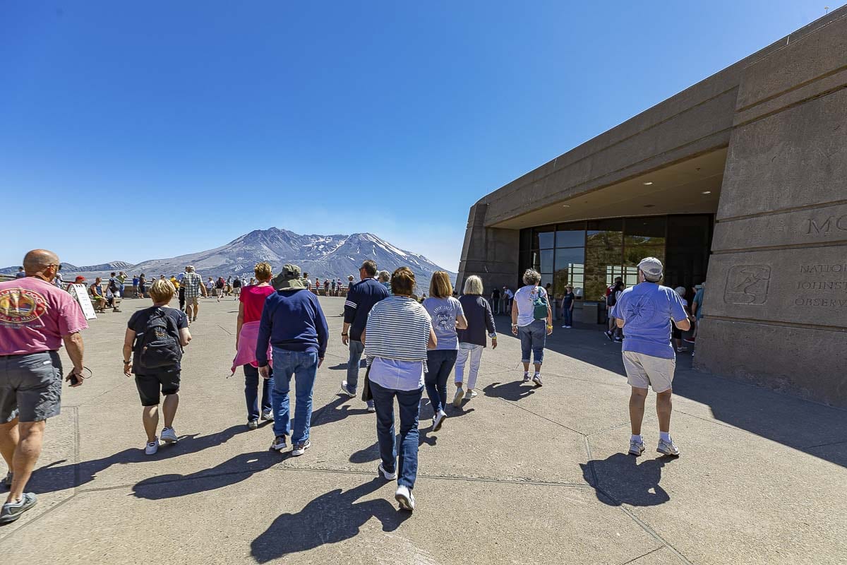 Shown here are people making their way to the main viewing platform outside Johnston Ridge Observatory on a clear day in July. Photo by Mike Schultz