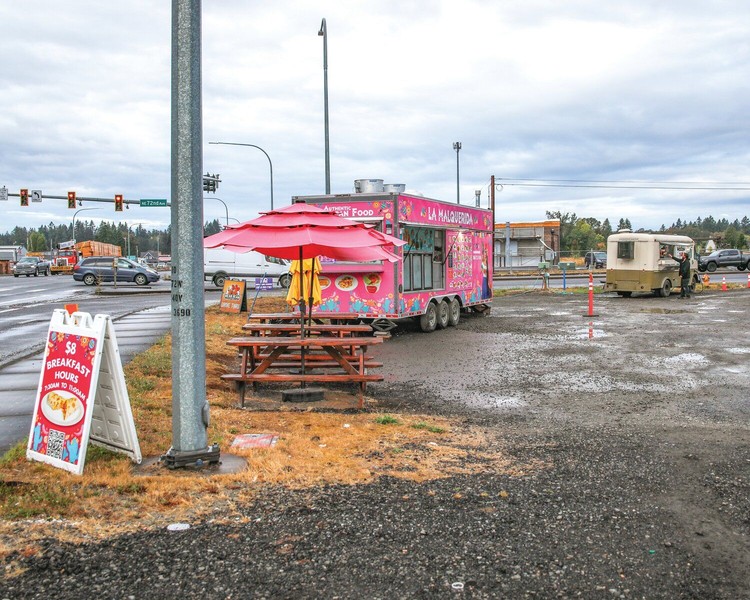 A pair of food trucks are parked near the intersection of state Route 502 and Northeast 72nd Avenue in Dollars Corner. The city of Battle Ground is seeking to add the area into its urban growth area.