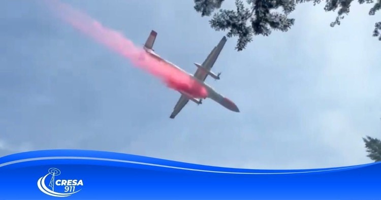 A plane fights the Hidden Meadows Fire in North Clark County.