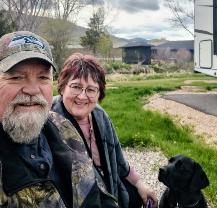 Tom and Sharon Vance are shown here with their beloved black lab Rosie.