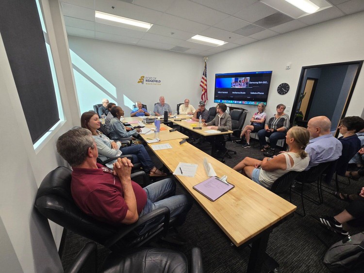 The Port commissioners and staff at the commission meeting on August 12.