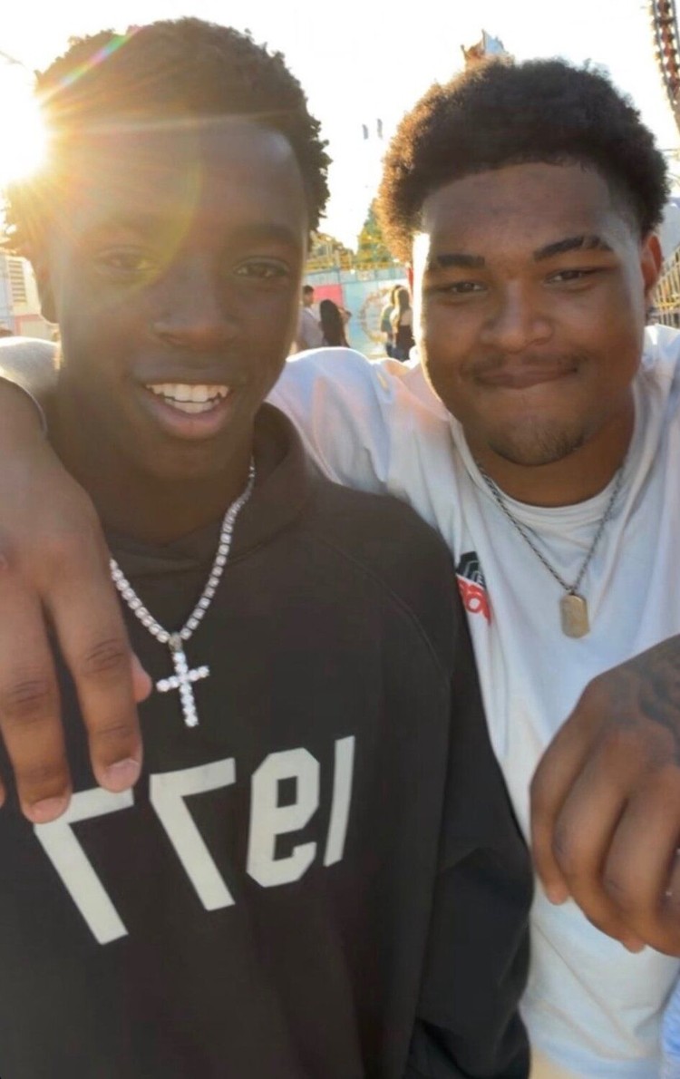 Trent Richardson and James Gill III pose for a photo together while attending the Clark County Fair.