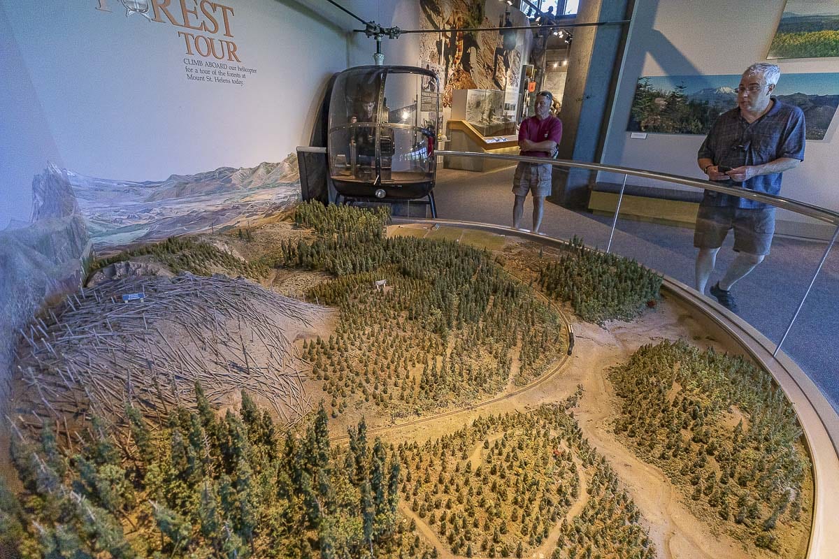 Inside the Forest Learning Center, an actual helicopter, shown here, serves as the cockpit for a virtual tour of the surrounding landscape. Photo by Mike Schultz
