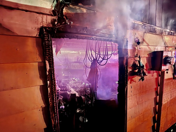 Eight Vancouver Fire units responded to an attached garage fire on NE 102nd Avenue before 5 a.m., displacing two people and a dog.